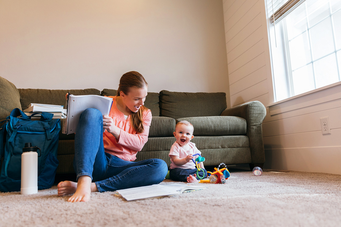 Student Parent Studying on Floor